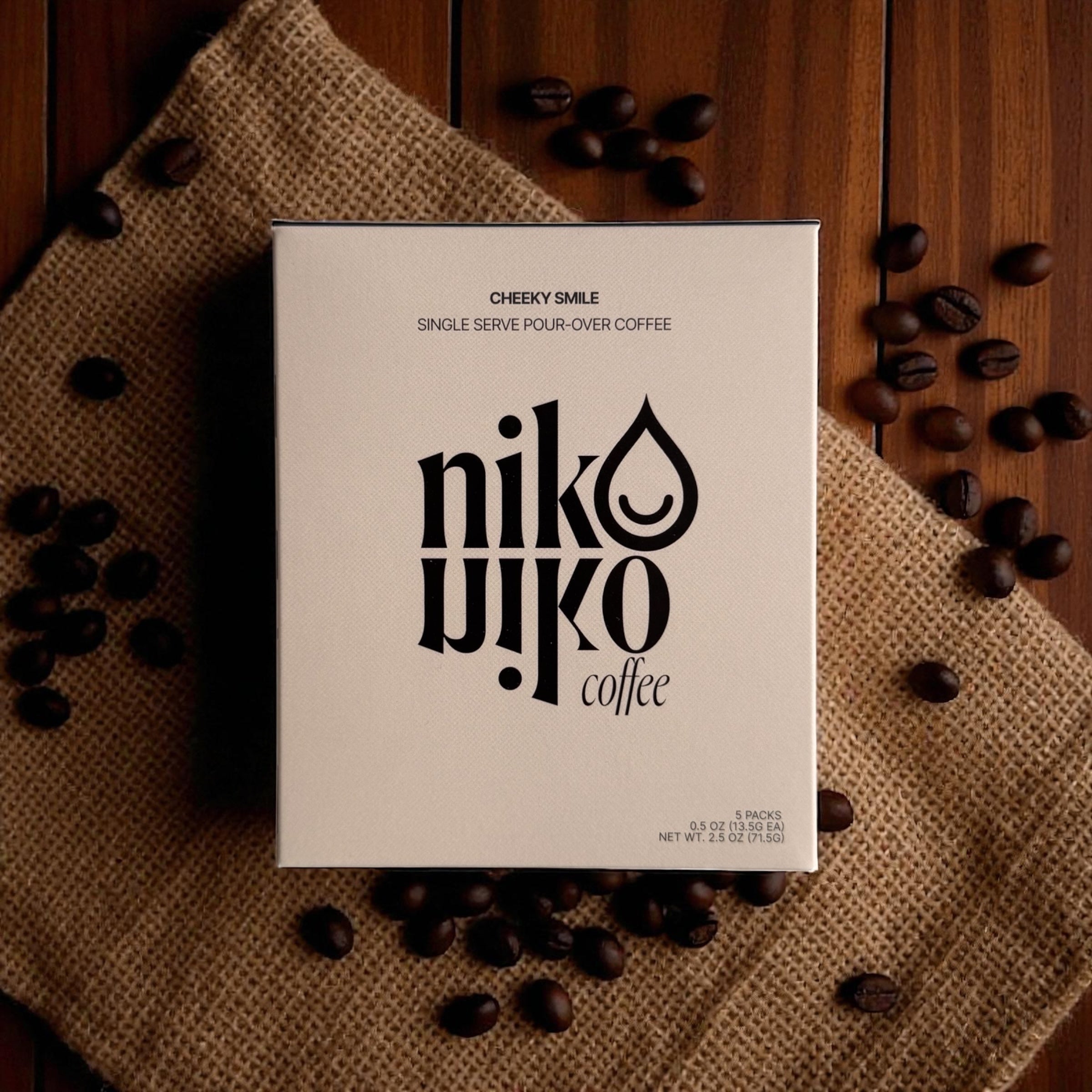 Niko niko coffee package with coffee beans on a wooden surface
